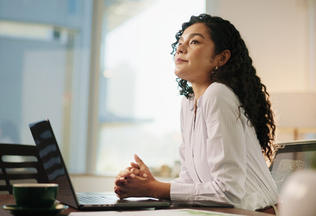 Business woman, thinking and laptop in office for legal research, case preparation or drafting will. Attorney, female person and advocate at law firm for court review, lawsuit idea or legislation